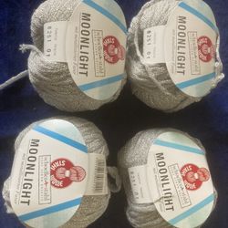 4 Skeins Of Silver Yarn