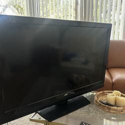 Tv With Fire tv stick And Two Remotes