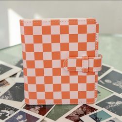 Holds 48 (2" X 3") Photo/Business Cards Checkerboard Pink & Orange Photo Album. Random Free photos included. This item is a Polaroid brand photo album