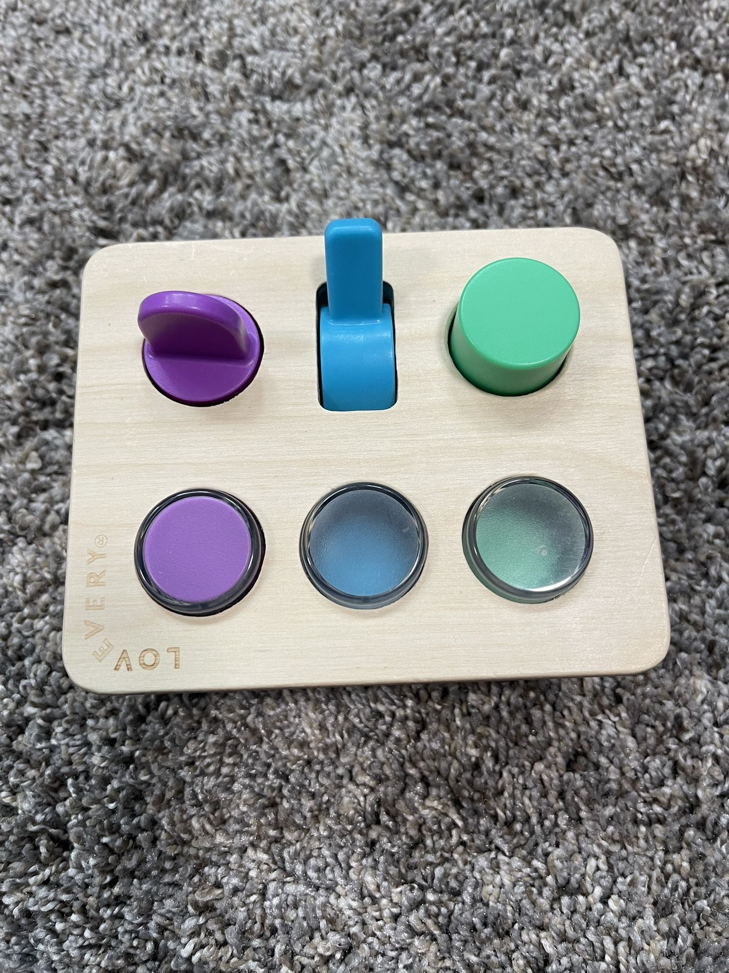 Lovevery the thinker. Sensory Switchboard baby toy cause and effect motor skills 12 month