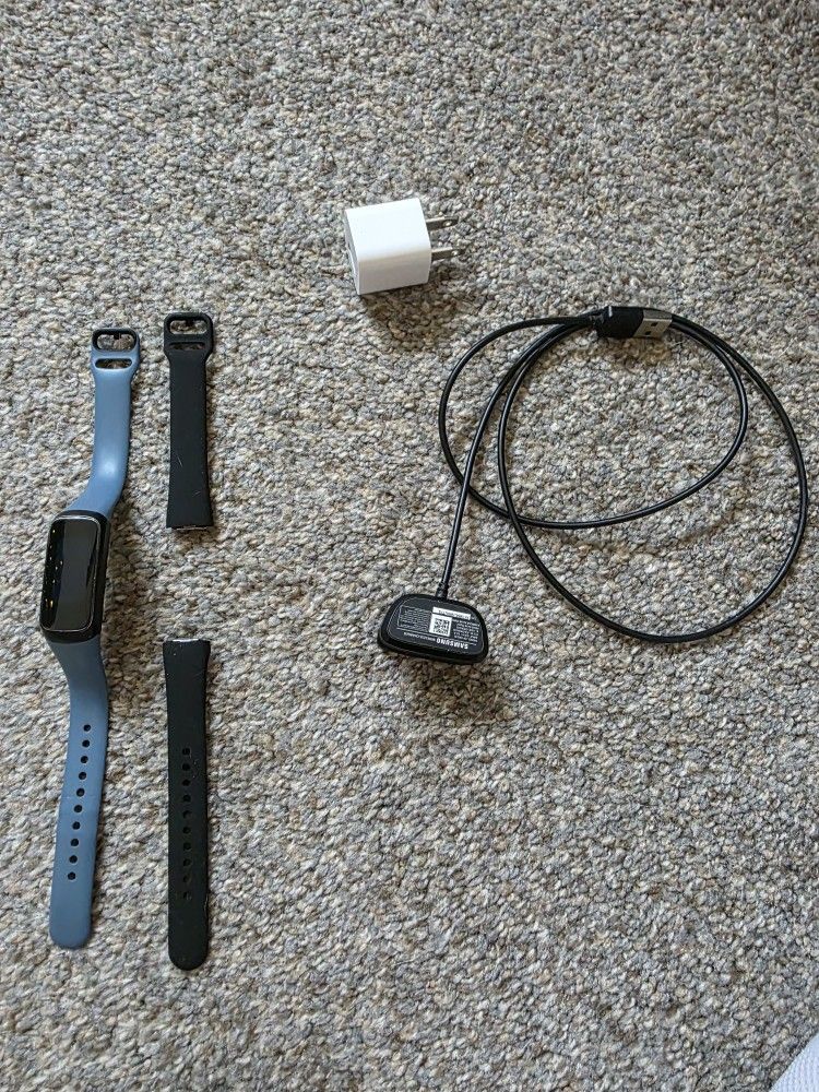 Galaxy Fit fitness tracker with charger and an extra band
