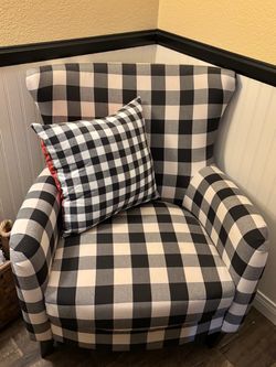 Black and white checkered accent chair and ottoman