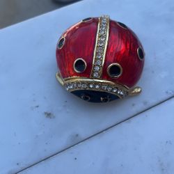 Gold Tone Metal Rhinestone Lady Bug Jewelry Box / Metal / Rhinestone / Approx size: 2.5" L x 2.5" W x 1.5"H / Color: Gold & Red