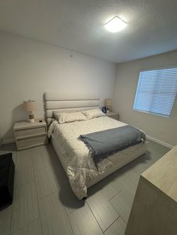 King-size bedroom set with drawers and two nightstands.