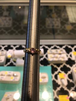 Gold ring with pink stone