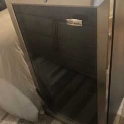 Free wine fridge, bar stools, white chairs, reclier king bed frame