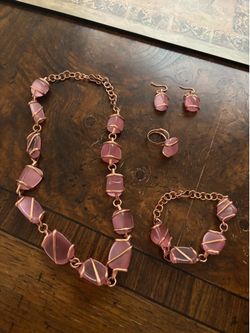 Brand new set of necklace, bracelet,earrings and ring new never used