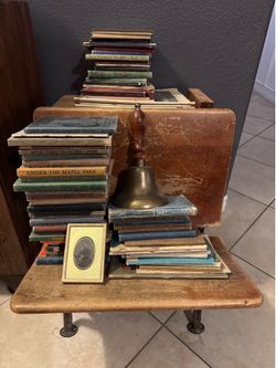 Vintage school desk with vintage textbooks and school bell