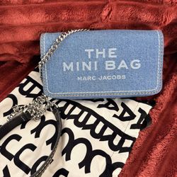 Marc Jacobs The Denim Chain Mini Bag in light wash denim. 