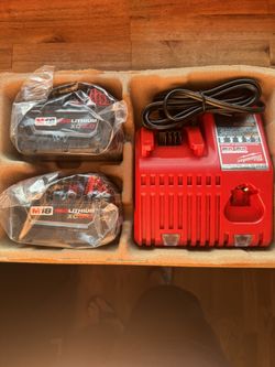 2 Milwaukee 5 Hour Batteries And Charger