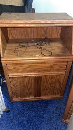 Wooden shelf with lights inside top