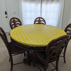 Round dinner table with chairs