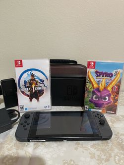 Nintendo Switch  + 2 Games