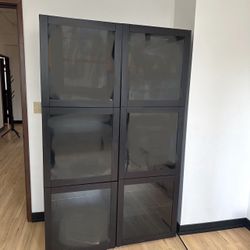 2 IKEA Black Shelves  with Glass Doors and Glass shelves. 