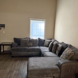 L-shaped sectional with an ottoman/chaise lounge.