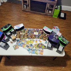 12 Pokemon Boxes  Cards 18 Tins And 8 Balls