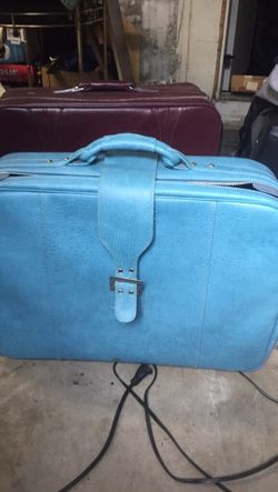 Large suitcase with wheels and pull handle