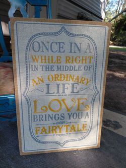 Wooden wall decor sign 16 in x 23.5 in "Once in a while right in the middle of an ordinary life Love brings you a Fairytale"