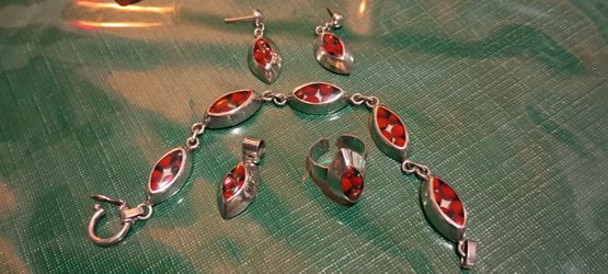 Earring bracelet, pendant, and ring you can size yourself it’s silver 9.25