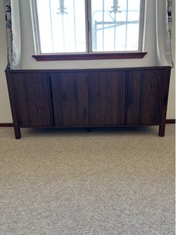 long dark wood veneer sideboard/buffet cabinet with four doors