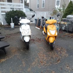 White Amigo Beemer And Yellow Wolf Mopeds