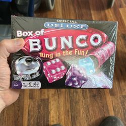 his image shows the Winning Moves Games Deluxe Box of Bunco, a popular dice game.  Product: Deluxe Box of Bunco game by Winning Moves Games.  Contents
