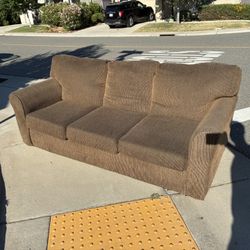 Comfortable brown fabric couch
