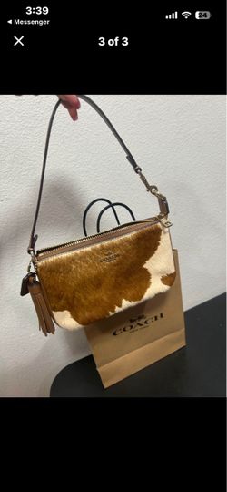 Coach cowprint purse