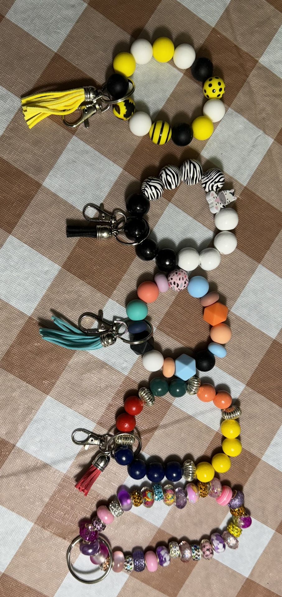 Wristlets, Keychains, Cellphone Charms And Backpack Charms