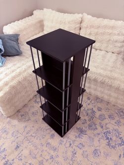 Black Rotating bookshelf/bar for drinks