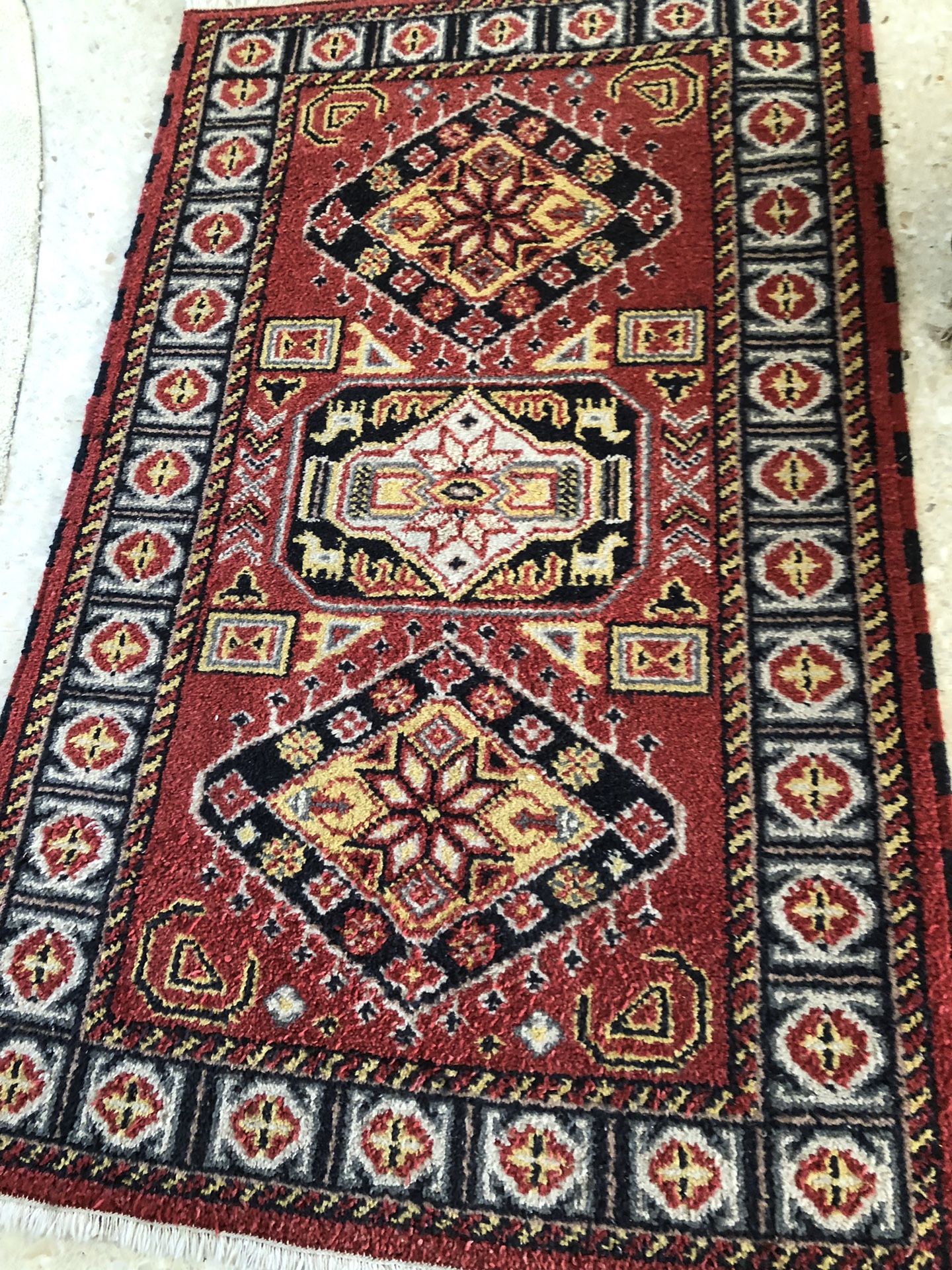 3’x5’ wool oriental small rug. Primarily dark red.