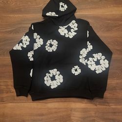 black hoodie with a white floral / abstract print