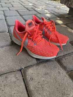 Pink Nike Zoom athletic shoes