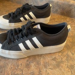 Adidas Sneakers.  Men’s 9.5/ Women’s Size 11