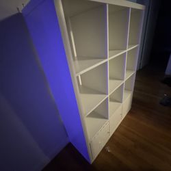 white cabinet with 3 doors and storage