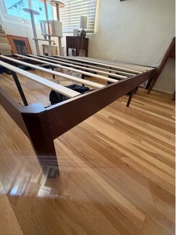 Queen bed frame with bent center support