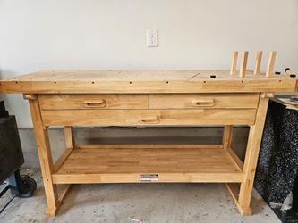 Workshop table with velvet drawers and vice