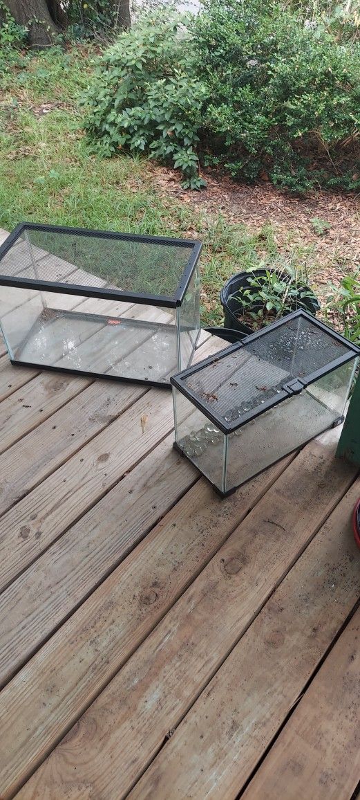 10 gallon aquarium with an oversize screen lid and smaller tank