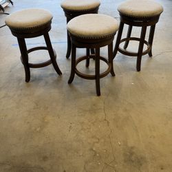 Four Swivel Chairs