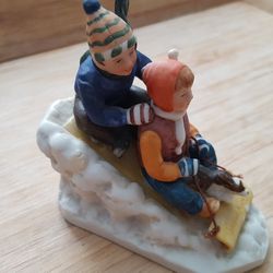 DOWNHILL RACER" PORCELAIN FIGURINE BY NORMAN ROCKWELL