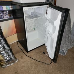 small freezer (100% functional) and microwave (warms food but have a malfunction)