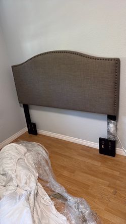 Tan/brown Fabric headboard with queen sized bed frame