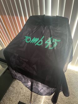 Tomb 45 Barber Cape brand new with box