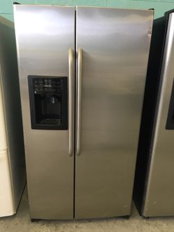 Stainless Side By Side Refrigerator With Ice N Water in the door
