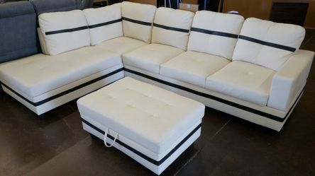 Contemporary white faux leather sectional. Floor clearance
