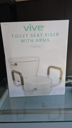 Brand new unused toilet seat riser woth arms