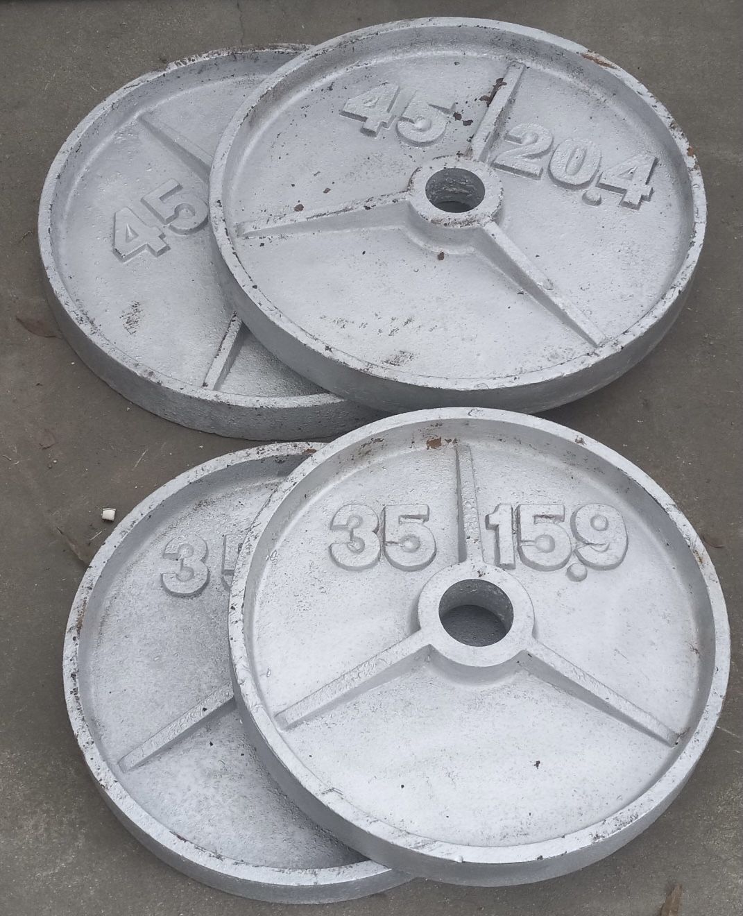 2 - 45 Lb plates and 2 - 35 pound plates