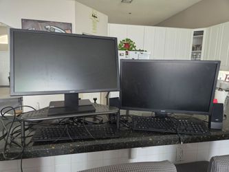 Two Acer Computer Monitors with Keyboards