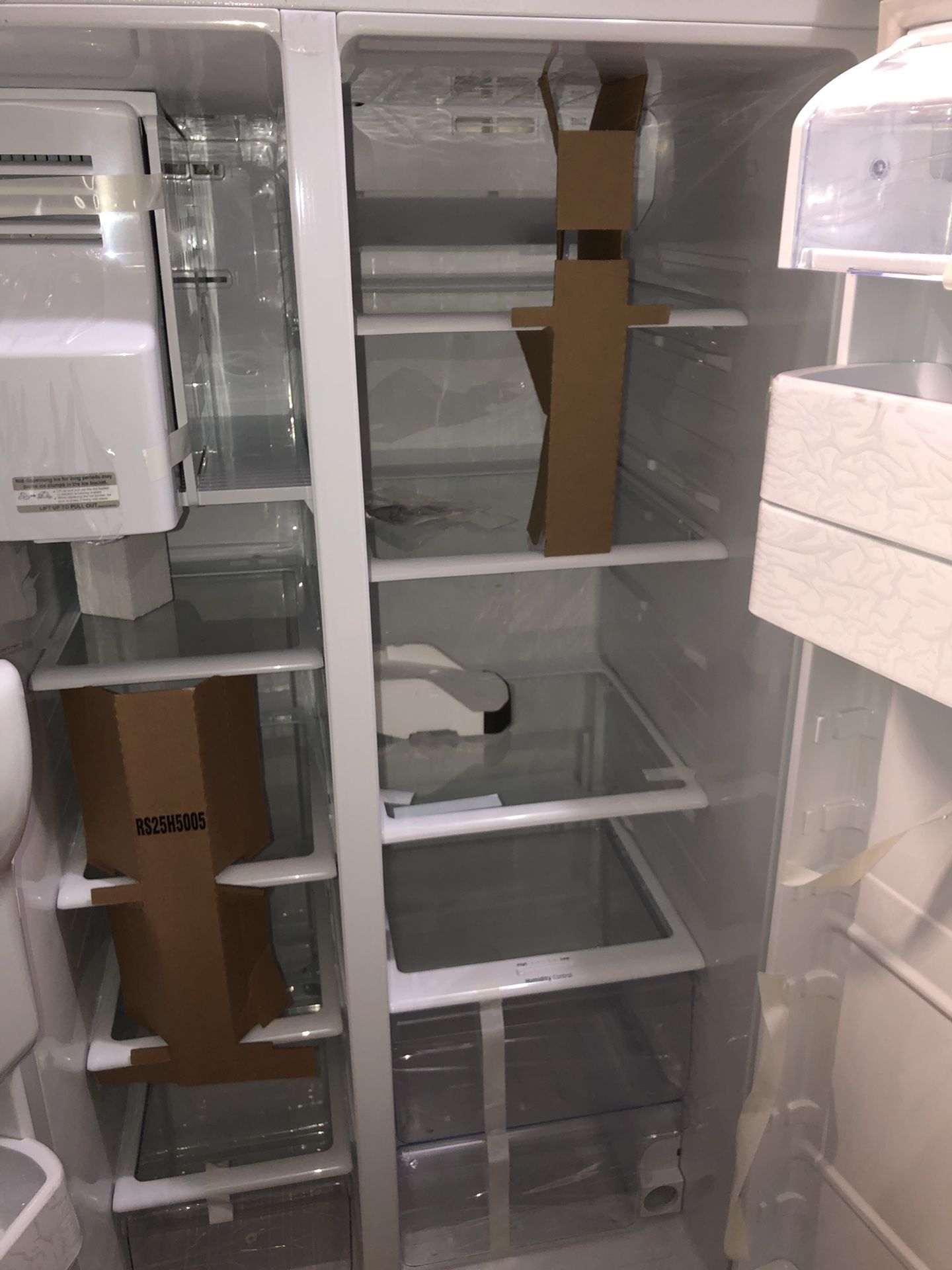 samsung white side by side fridge with water/ice dispenser