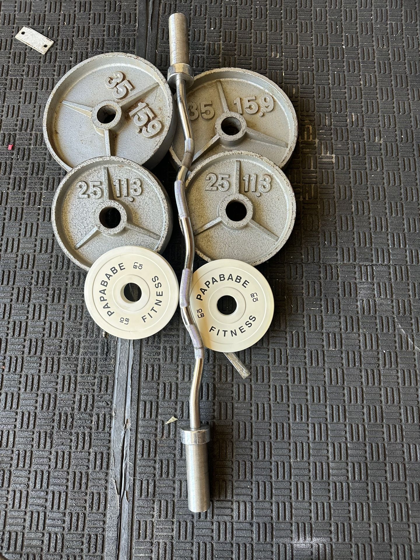 140lbs of Olympic weights with curl bar